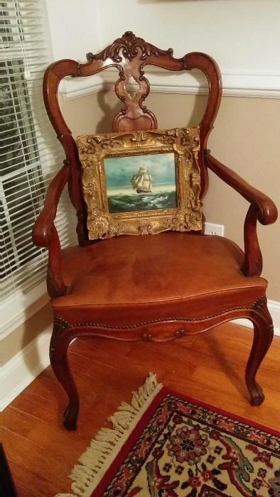 Spanish hand carved mahogany/leather armchair, as an easel for an original, artist-signed sailing ship painting 