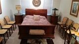 Thomasville Queen Size sleigh bed, w/pair of matching nightstands, stern looking character on an antique brass charger making sure that the Viagra is working correctly.                                                                              Note the six chairs, looking like a doctor's waiting room - what are they waiting for?