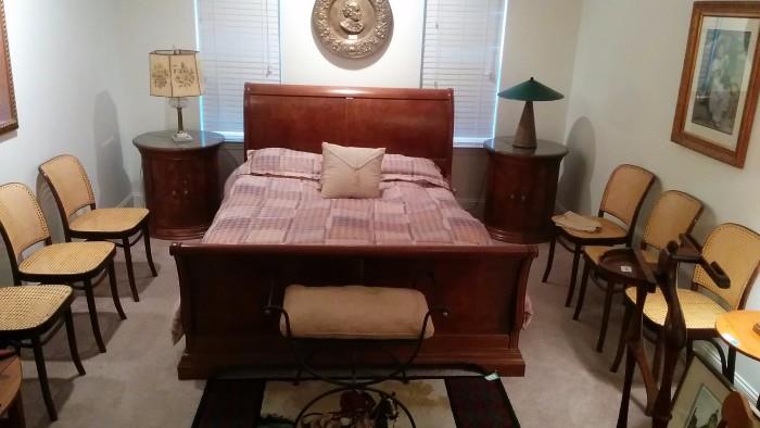 Thomasville Queen Size sleigh bed, w/pair of matching nightstands, stern looking character on an antique brass charger making sure that the Viagra is working correctly.                                                                              Note the six chairs, looking like a doctor's waiting room - what are they waiting for?