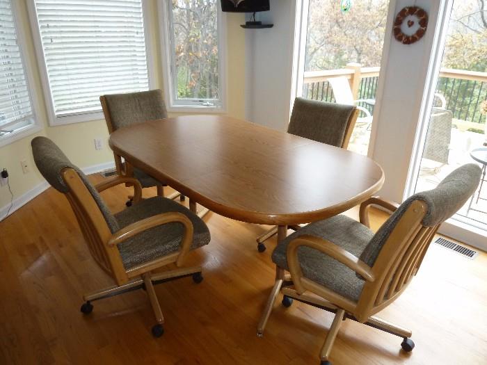 Kitchen table with 4 swivel/roller chairs