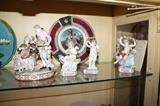Meissen courting couple figurine and "Cupid Motto" figurines