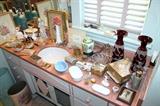 Vintage glassware, trinket boxes, and bathroom accessories