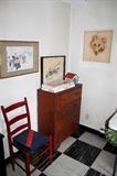 Vintage chest-of-drawers, chair, and artwork