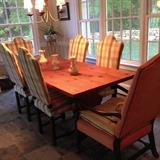 Pine dinner table with five upholstered chairs