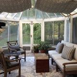 Teak couch with cushions and pillows, 2 teak side chairs with cushions and pillows, hand painted tray table, antique blanket chest, gar dent figure plant holder (cupid) reader's stand, wrought iron table