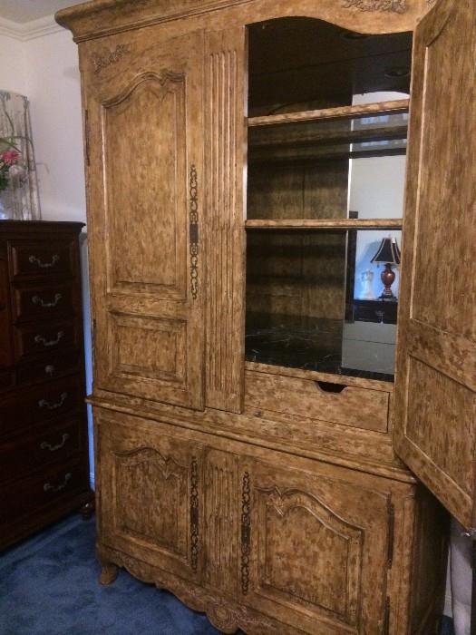 Mirror and marble insert shelf allows this armoire to serve as a bar. (from the estate of Mrs. Pat Prince)