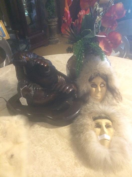 Bronze walrus and pup; Alaskan masks, some of the items from the estate of Mrs. Lena Callender