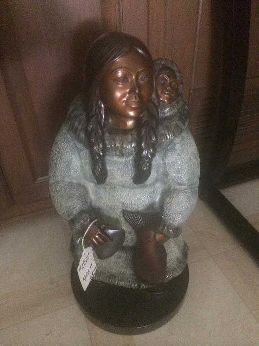 Alaskan sculpture of a mother and her baby
