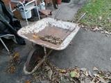 Vintage wheelbarrow with metal wheel