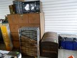 Large one piece wooden cabinet, microwave, old camp beds, old trunk