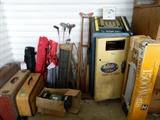 Old suitcases, golf clubs, chairs, heater, Old Reliable Quik Check tube tester...very neat.