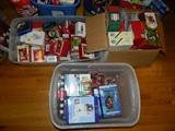 Many boxed, new Hallmark and other ornaments.