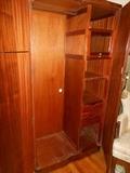 Interior of Burl Walnut Double Door Wardrobe with Brass Hardware Custom interior including glass cover hat cubbies