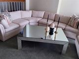 Creme sectional and vintage mirror coffee table