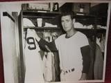 Ted Williams at his locker holding number 9 only one known.