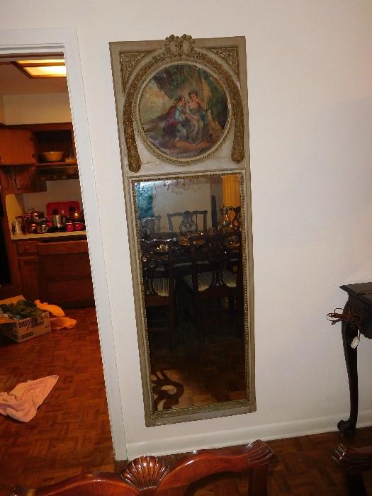 Antique peer mirror with oil painting at top