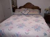 antique bed with quilt