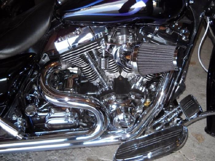 DESCRIPTION

Selling a 2004 Fully Customized Road King Custom. Powered by a 117” c.i. professionally built V-Twin engine. I am the second owner. I bought as repo had her built and have put all the current miles her. As you will see below she houses a high horse (128 HP) power motor. That said I have never drag raised the bike, my love for speed is top end pull and pull she does. My best to date is 140 mph she had more but I didn't. I have far too much money invested to disrespect her by treating her like a drag bike but if I choose to she'd be hard to beat.

Engine Features: 
• 117 ci V-Twin: Professionally built by Jim (Smiley) Smith. Jim is the multi record holder chief mechanic in AHDRA top fuel class.
• Cylinder Heads: “Pro Touring Elite” with manual compression release built by T-Man Performance.
• Cams: 590’s by T-Man Performance.
• Cam Plate: “Fuelling” Billet with Gear Drive.
• Cylinder and Pistons: Axtell MM.
• Rods and Crank: Screaming Eagle.
• Oil Pump: “Fuelling” 7000 High 