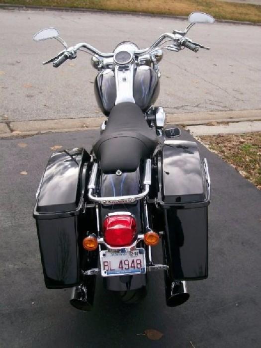 DESCRIPTION

Selling a 2004 Fully Customized Road King Custom. Powered by a 117” c.i. professionally built V-Twin engine. I am the second owner. I bought as repo had her built and have put all the current miles her. As you will see below she houses a high horse (128 HP) power motor. That said I have never drag raised the bike, my love for speed is top end pull and pull she does. My best to date is 140 mph she had more but I didn't. I have far too much money invested to disrespect her by treating her like a drag bike but if I choose to she'd be hard to beat.

Engine Features: 
• 117 ci V-Twin: Professionally built by Jim (Smiley) Smith. Jim is the multi record holder chief mechanic in AHDRA top fuel class.
• Cylinder Heads: “Pro Touring Elite” with manual compression release built by T-Man Performance.
• Cams: 590’s by T-Man Performance.
• Cam Plate: “Fuelling” Billet with Gear Drive.
• Cylinder and Pistons: Axtell MM.
• Rods and Crank: Screaming Eagle.
• Oil Pump: “Fuelling” 7000 High 