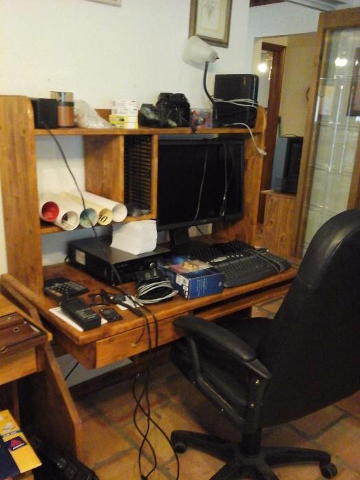 Desk with hutch, computer, and assorted electronics