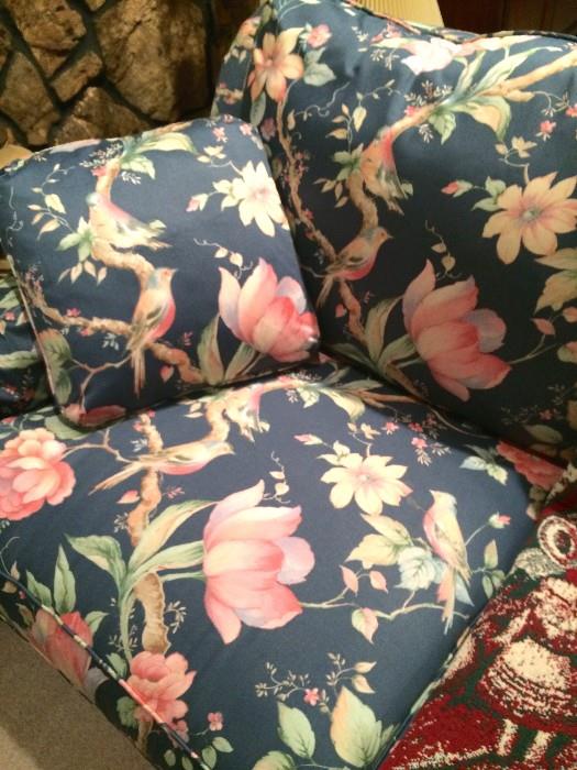 Two very large brand new matching sofas with birds on blue background with pink and green accents