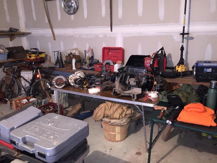 garage full of tools/wood chipper/chain saws/ many 