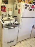 apartment size gas stove and Frigidaire fridge