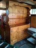 Large, solid wood knotty pine hutch. Can be taken apart for transport. Custom built approximately 1953.