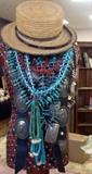 Turquoise necklaces and concho belts.