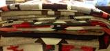 Several Navajo rugs.