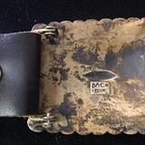 Signed concho belt buckle.