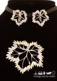 Napier sliver tone maple leaf clip earrings and pin set.