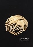 Monet gold-tone pin. Logo raised on back.