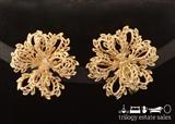 Monet gold tone clip earrings. Monet PATD imprinted on clip back.