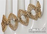 Trifari 7" gold-tone filigree bracelet. Trifari logo has crown above the T and © above the name.