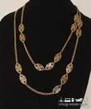 Trifari gold-tone 48" necklace. Trifari "T" with crown charm attached at ringspring clasp.
