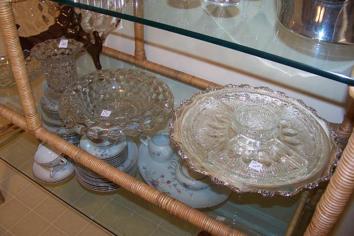 The piece on the right is a nice silverplate lazy susan with crystal trays