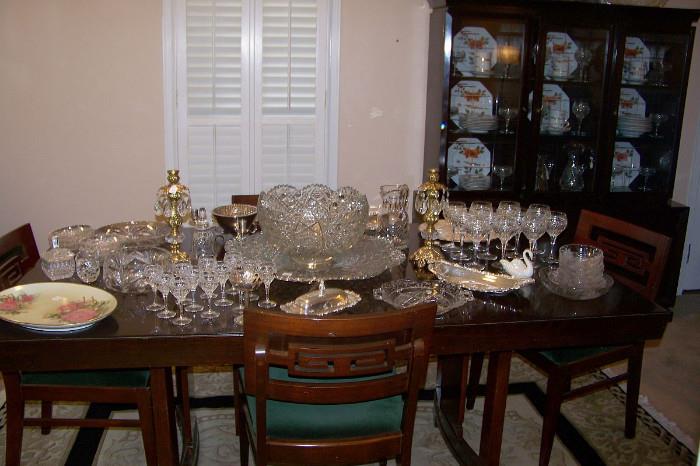 Dining table, chairs and china cabinet.  The set has a dramatic black finish - 