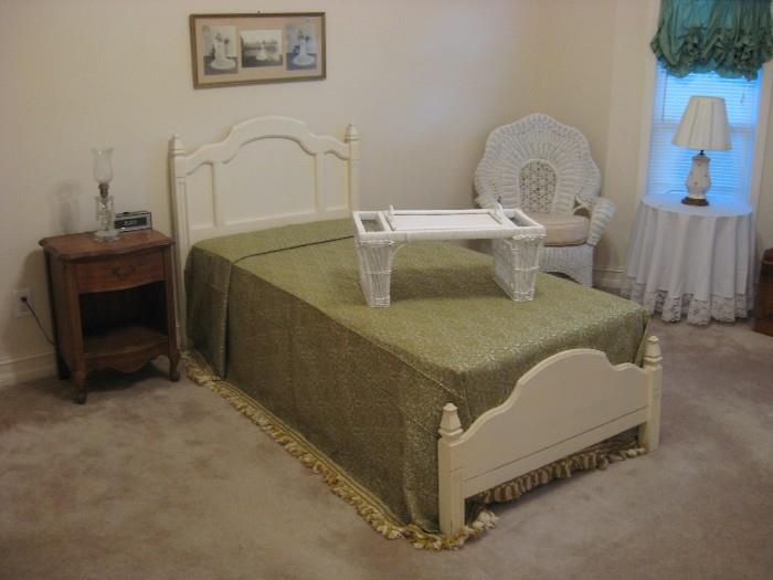 Twin bed with full vintage spread.
