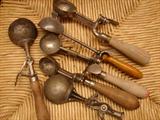 A few of many vintage ice cream scoops