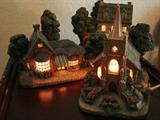 Thomas Kinkade lighted houses and church.