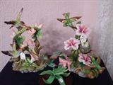 Two larger hummingbird figurines.