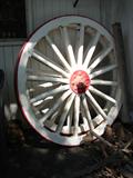 The evening sun strikes this pair of wagon wheels much like it would have a century ago. Remove the paint if you prefer them natural color.