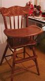 Child's high chair with pressed back
