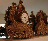 Two gilt metal tabletop or mantle clocks are reduced to sell.
