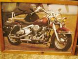 Large framed print of a motorcycle.