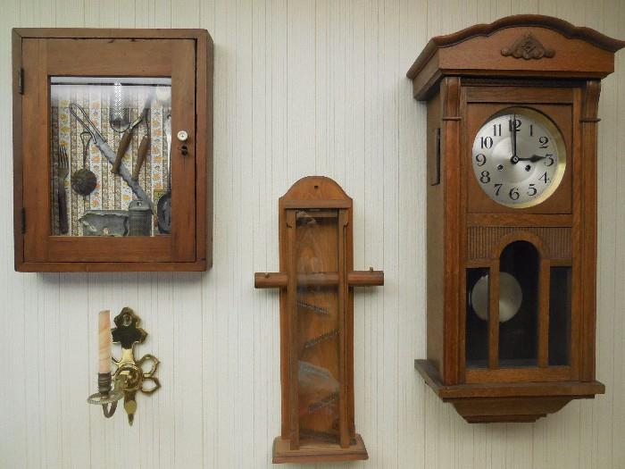 Left to right: Grandma's favorite cooking implements in a glass front, cupboard style shadow box. Gumball dispenser, Antique clock with key (not working)