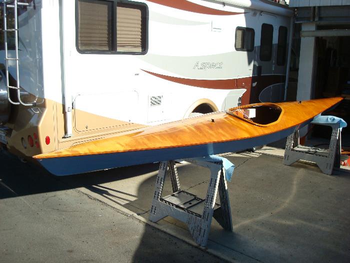 Handmade kayak, includes spray skirt, life vest and custom made cradles to fit onto a roof rack