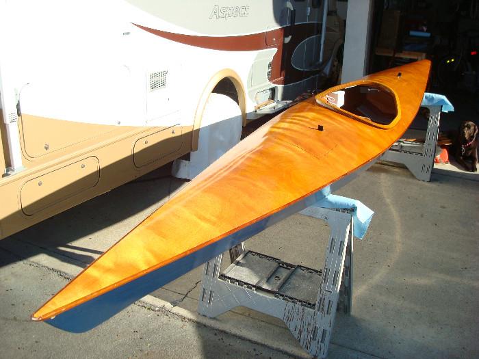 Handmade kayak, includes spray skirt, life vest and custom made cradles to fit onto a roof rack