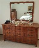 Antique Dresser with an Antique Mirror hanging overtop